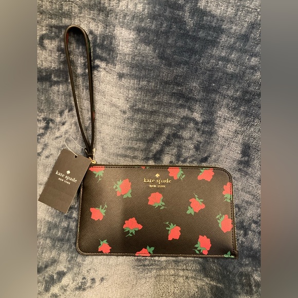 kate spade Handbags - Kate Spade, new with tags, gorgeous black with red flowers, wristlet. So chic!